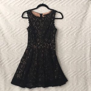 Black lace dress with nude lining. Size 1, zipper back.